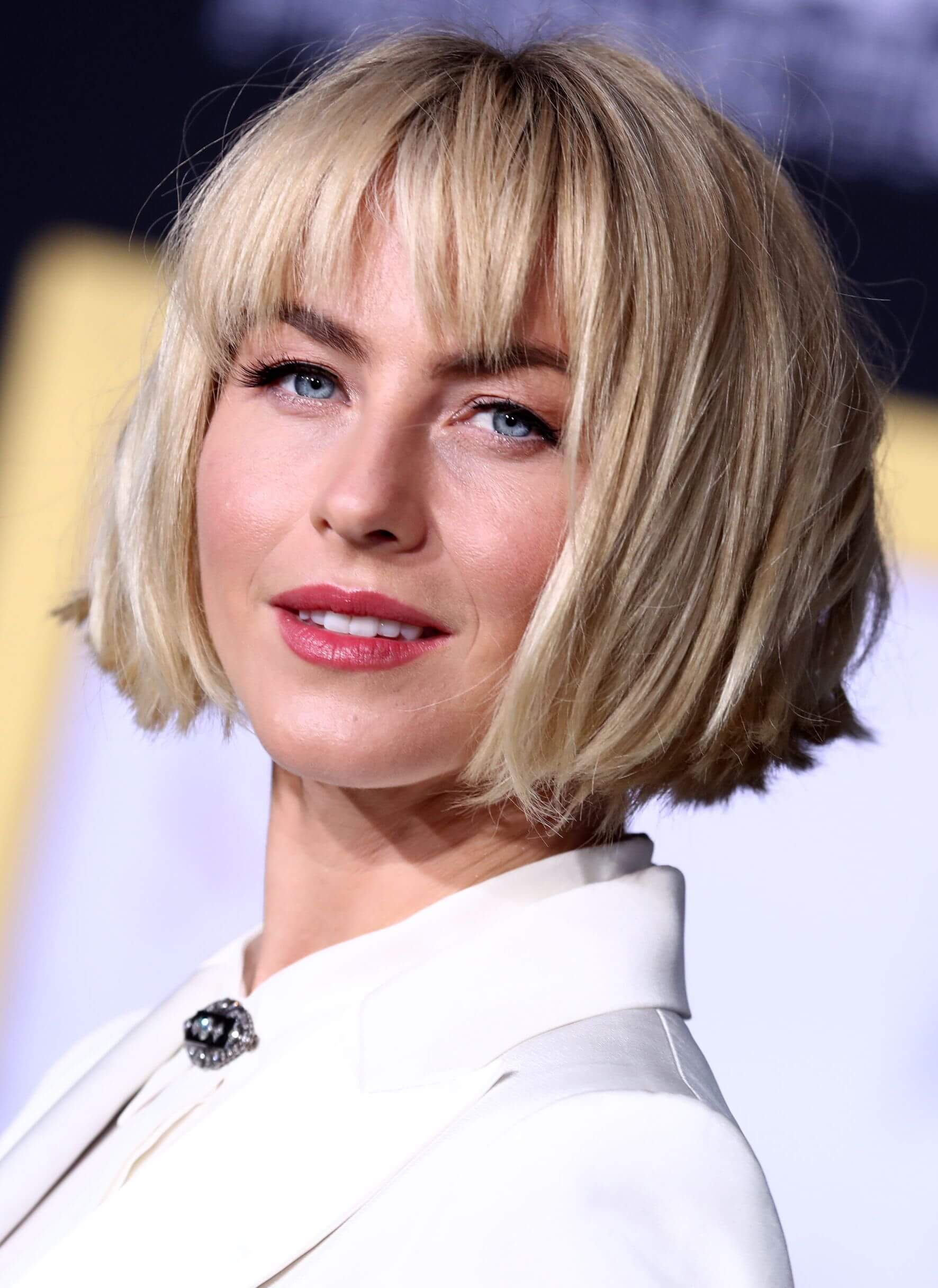 A woman with a blunt bob with heavy bangs
