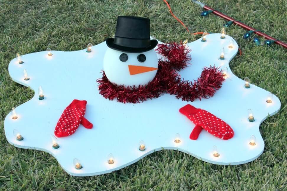 21 Most Inspiring Snowman Christmas Decoration Ideas { 11 } Melting Snowman Whimsical Yard Decor - 21 Most Inspiring Snowman Christmas Decoration Ideas
