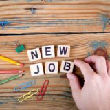 New Job. Wooden letters on the office desk