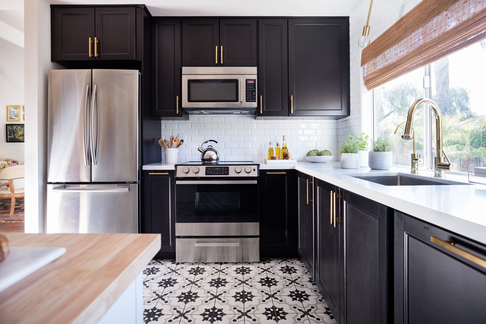 red kitchen wall cream cabinet black countertops